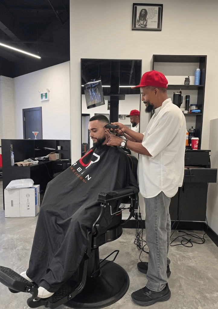 Dexter cutting hair at Urban Precision Barber Shop